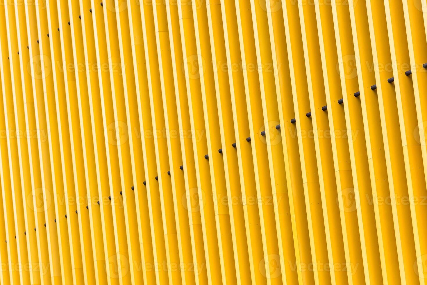 Detail of yellow metal building facade photo