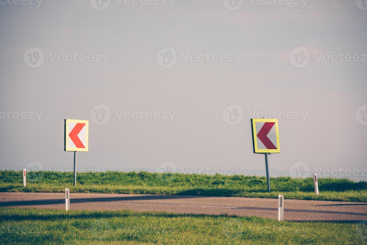 Turn left sign on a country road photo
