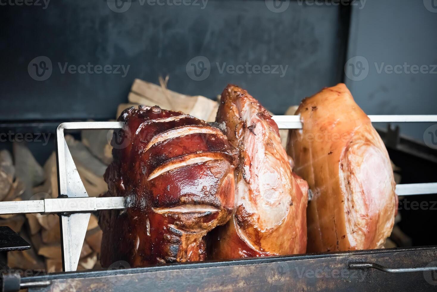 roasted pig knuckle on the spit photo