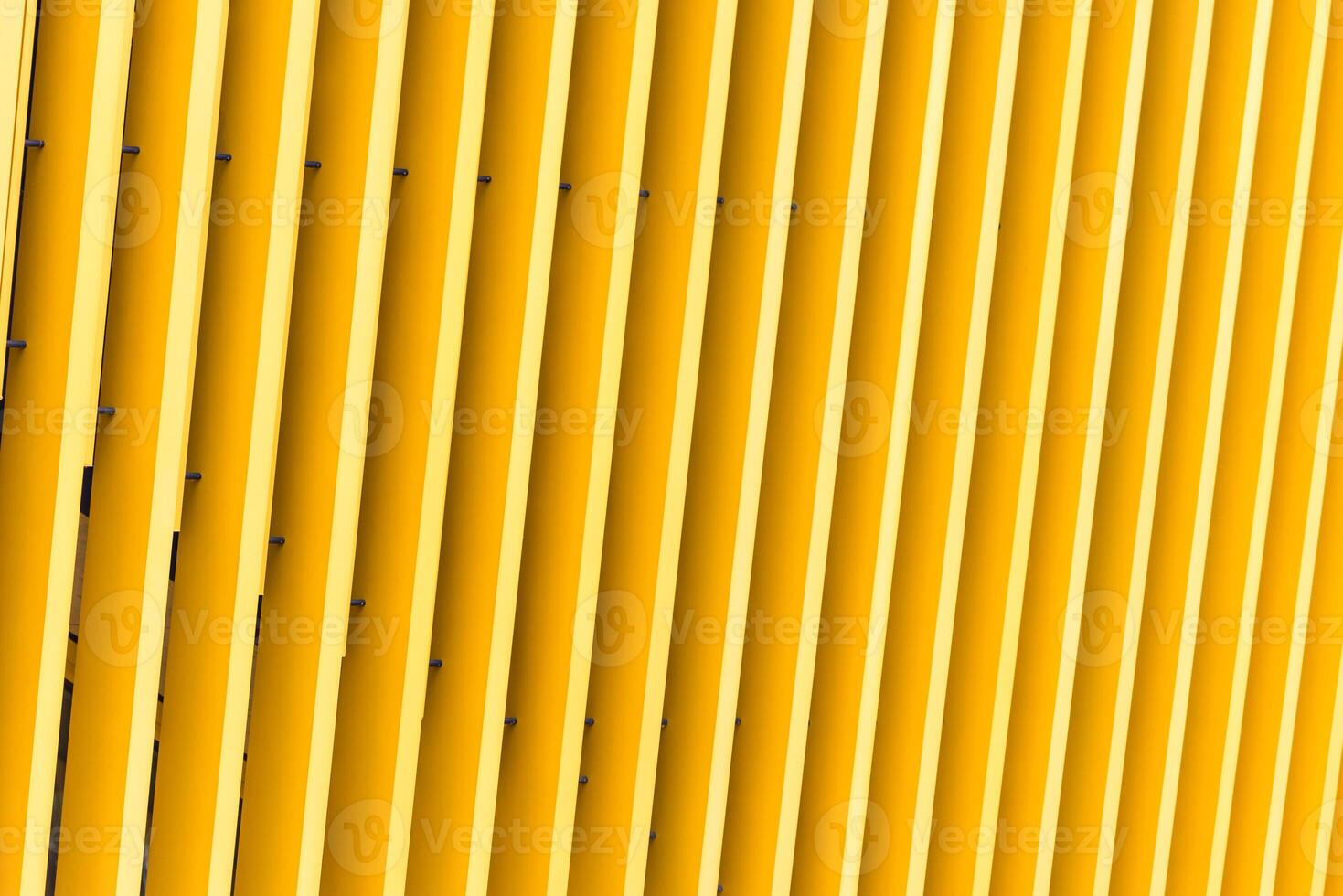 Detail of yellow metal building facade photo