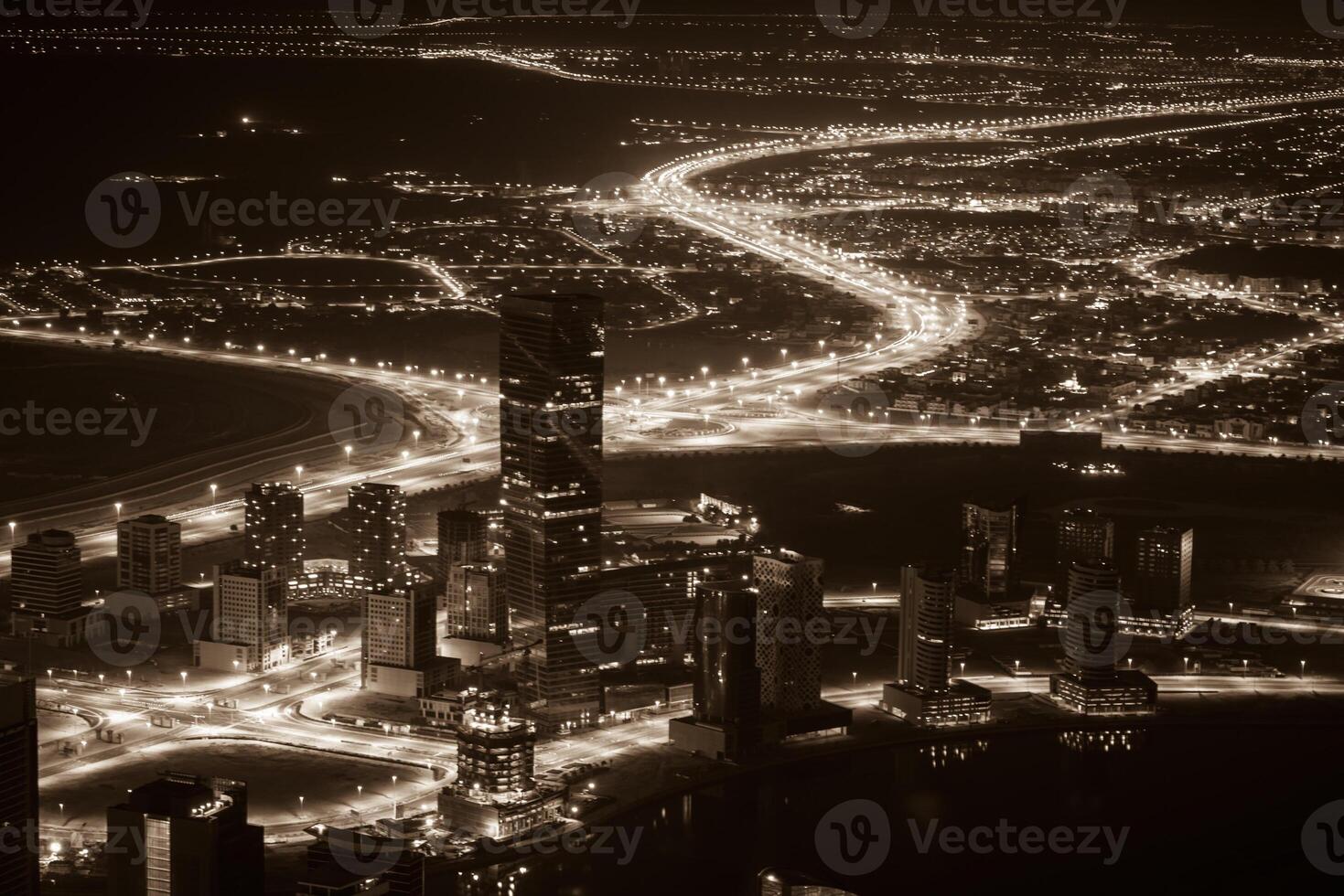 Dubai downtown night scene with city lights. Top view photo