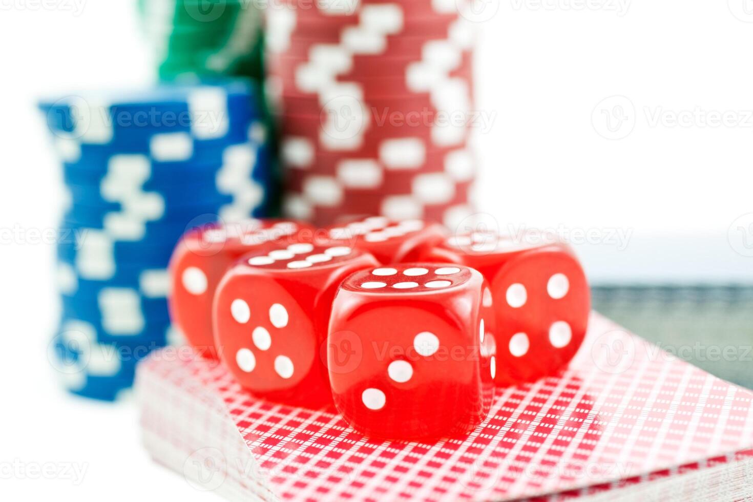 poker chips, cards and red dice cubes photo