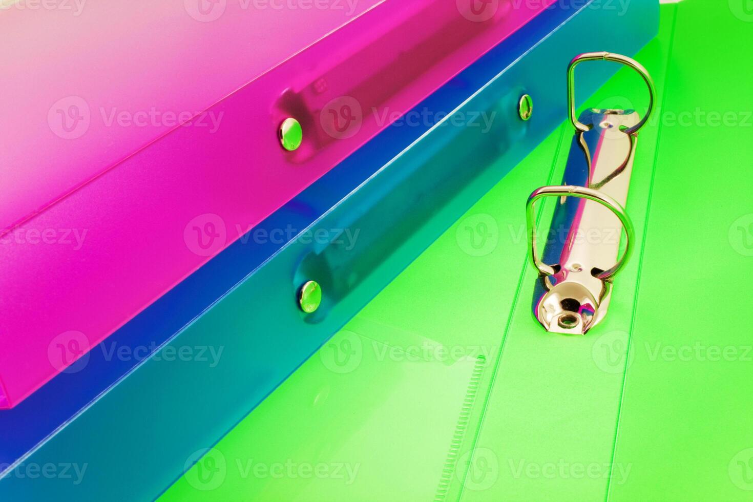 three multicolored folders photo