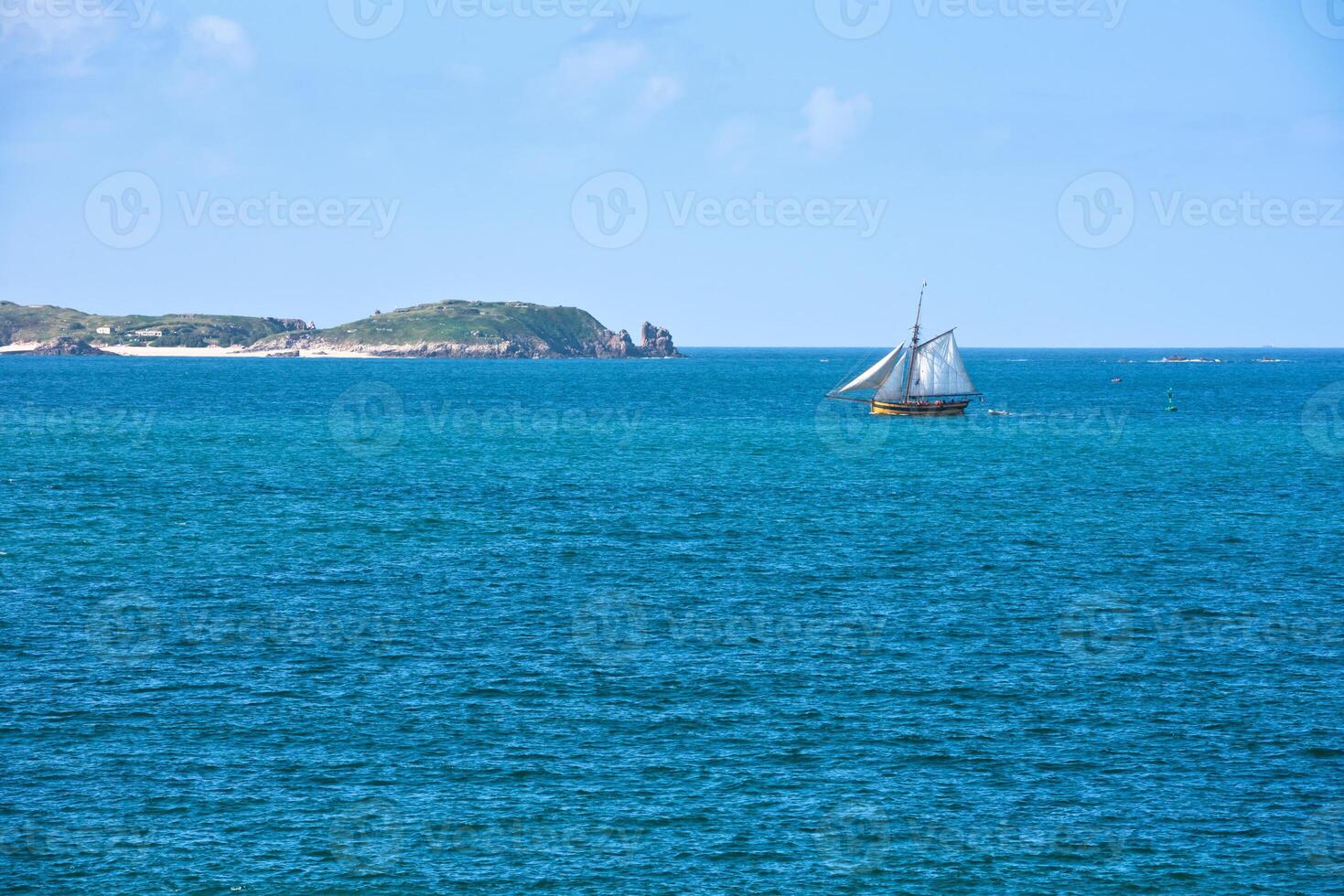 Bright blue sea and a yacht photo