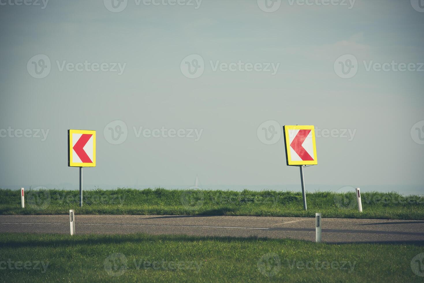 Turn left sign on a country road photo