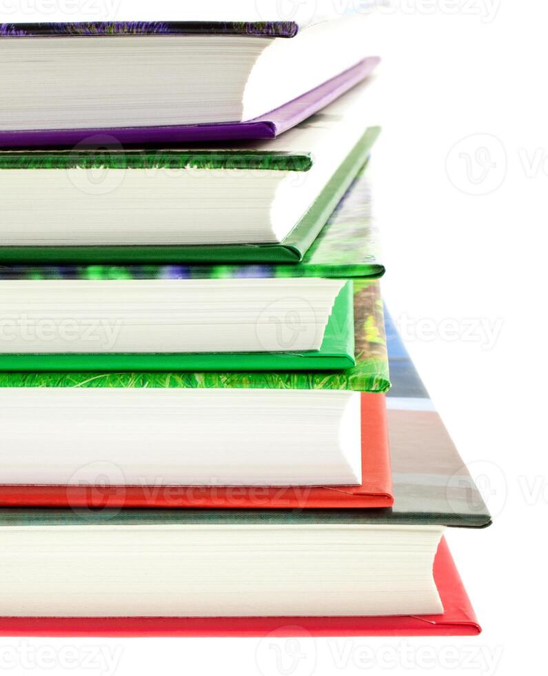 multicolored books stack isolated photo