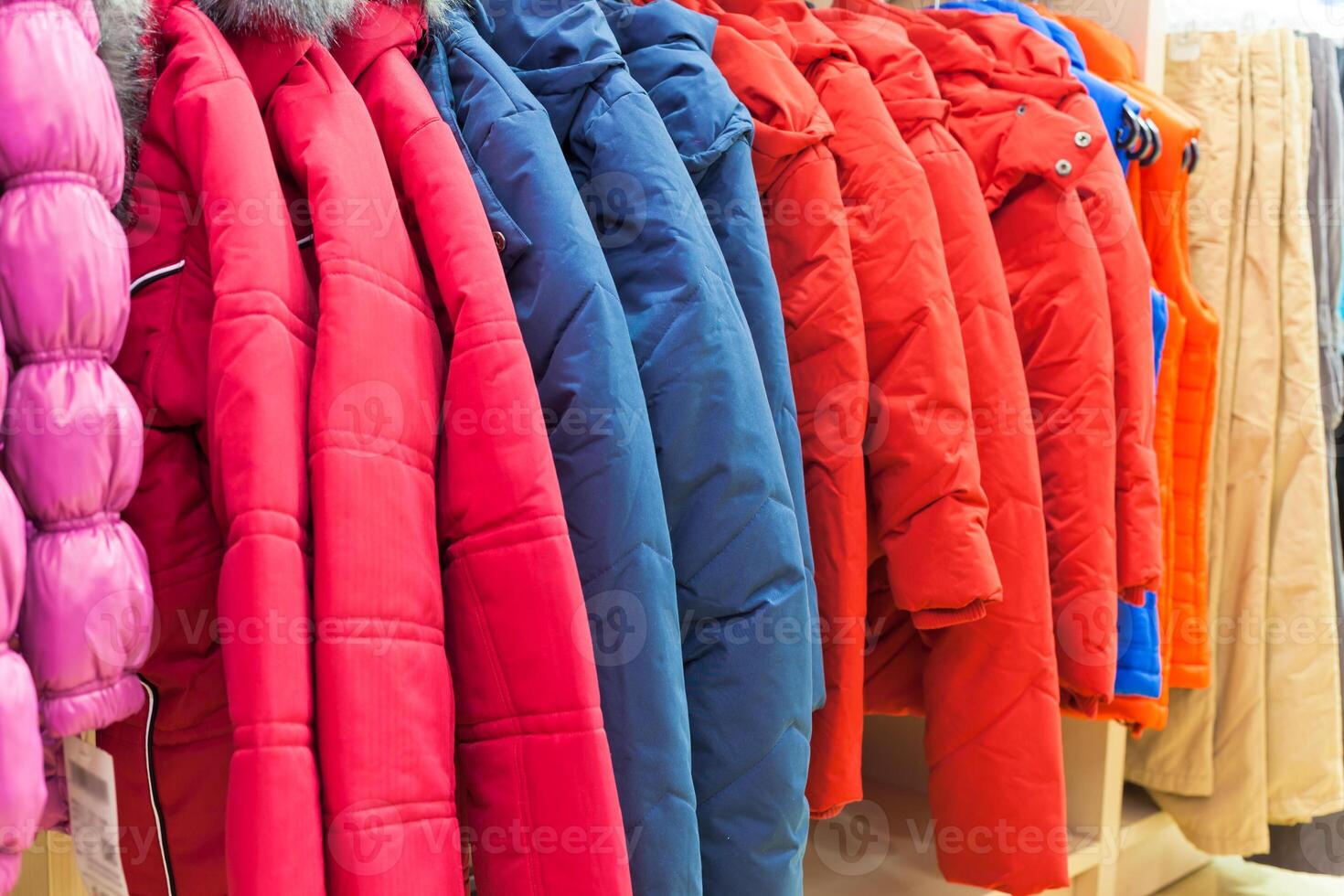 Winter clothes hanging at a store photo
