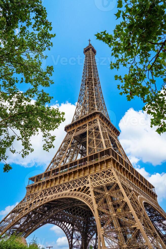 Marvel at the iconic Eiffel Tower standing tall and proud in the heart of Paris. Its intricate iron latticework and majestic height make it an architectural masterpiece. photo