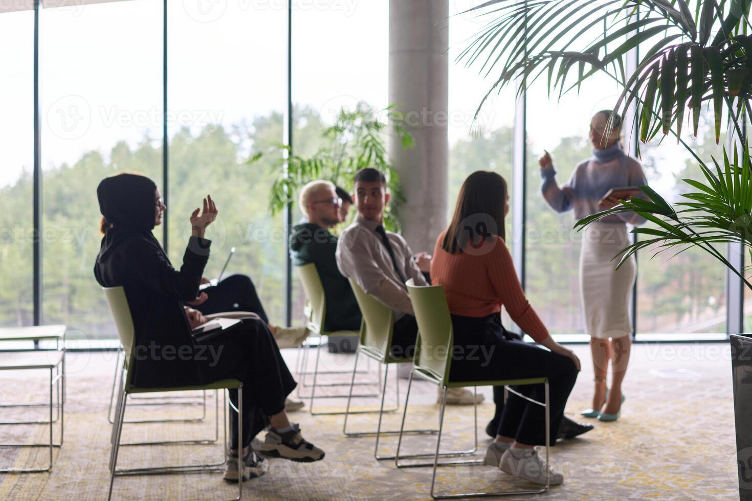 A businesswoman leader guiding a meeting with her colleagues, discussing business challenges, marketing strategies, and new plans for growth and success photo
