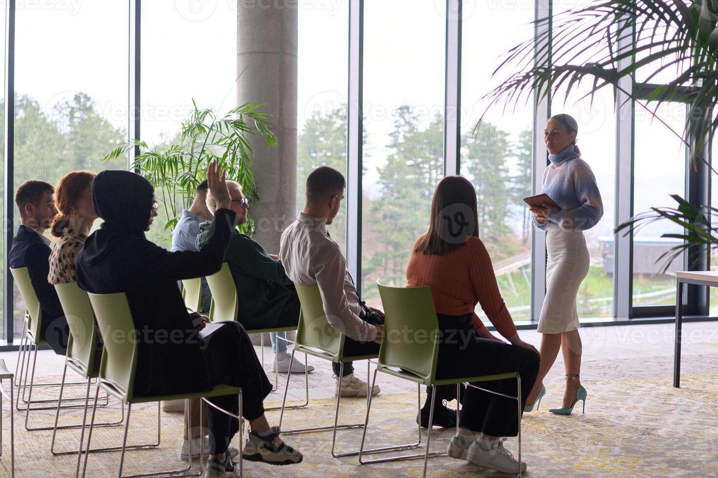 A businesswoman leader guiding a meeting with her colleagues, discussing business challenges, marketing strategies, and new plans for growth and success photo