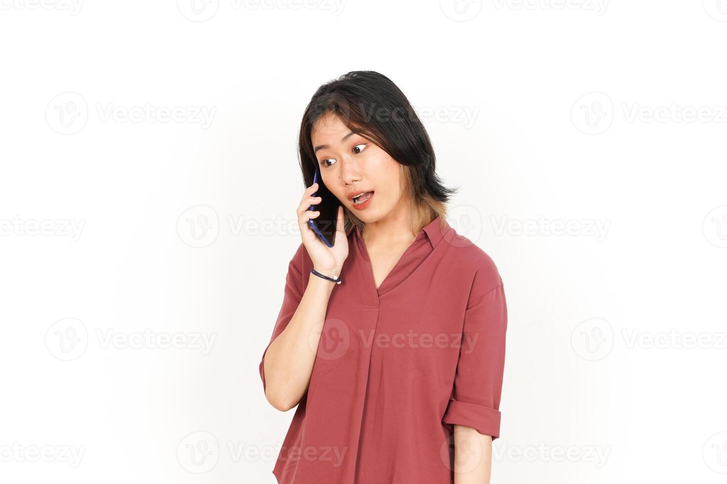 Make a Phone Call Using smartphone with angry face Of Beautiful Asian Woman Isolated On White Background photo