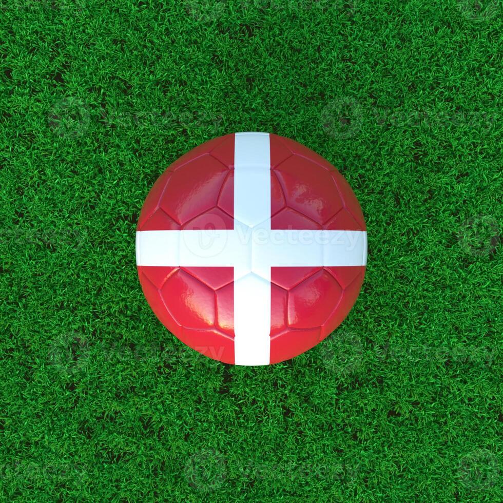 Flag Of Denmark On Soccer Ball With Grass Background photo