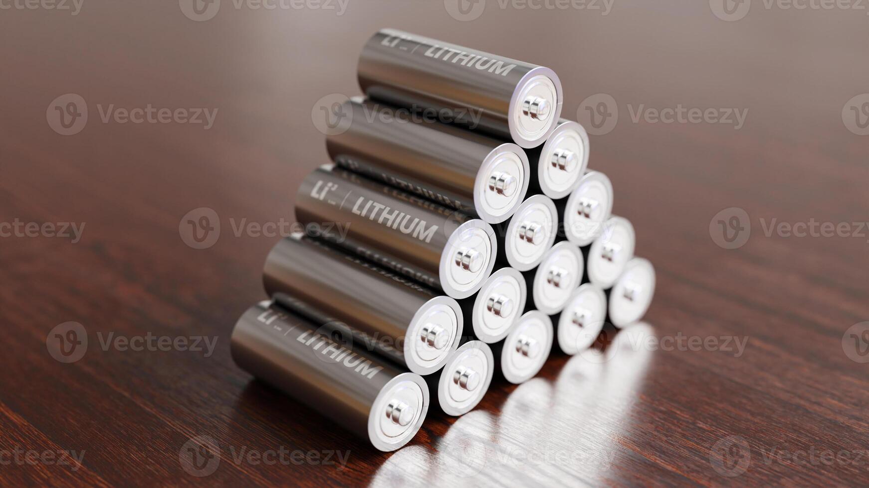 A pile of Lithium batteries on wooden table photo