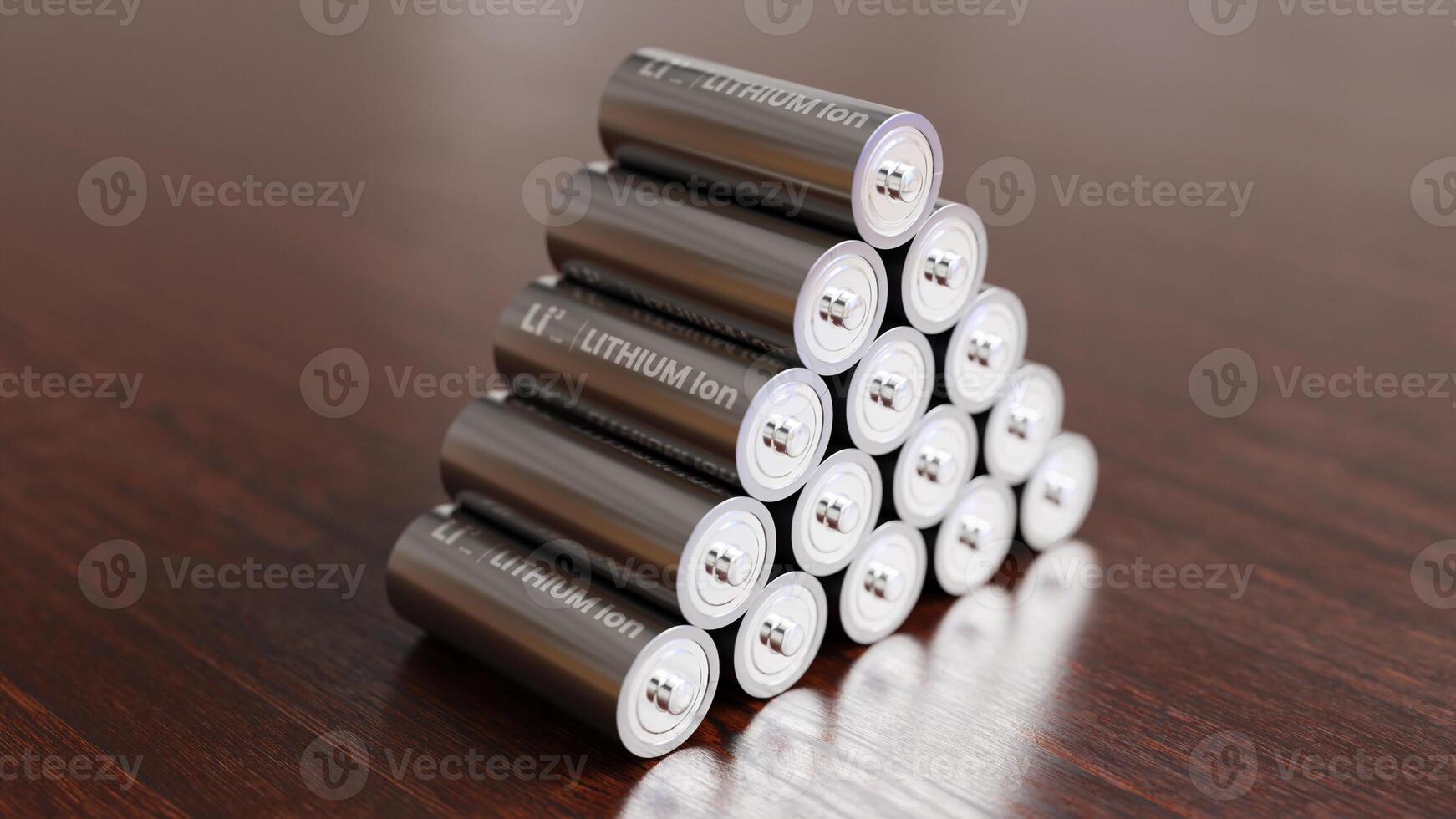 A pile of Lithium Ion batteries on wooden table photo