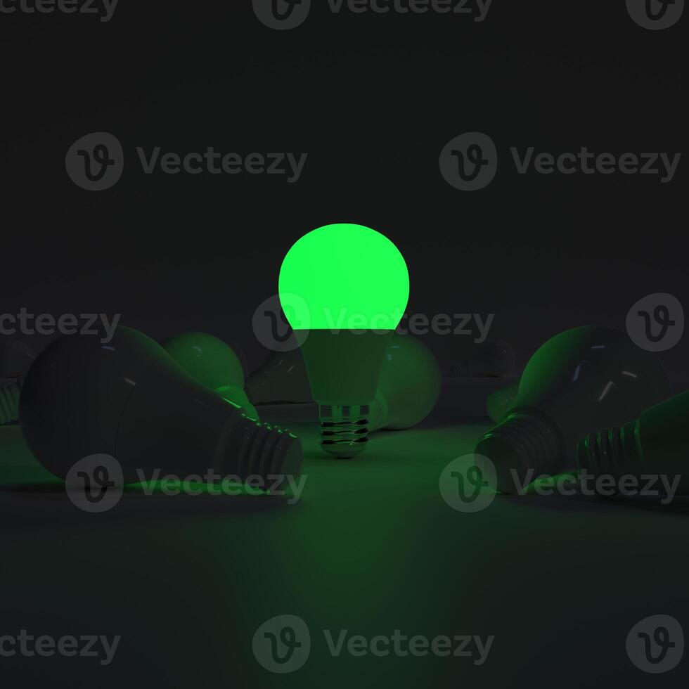 One of Lightbulb glowing among shutdown light bulb green photo