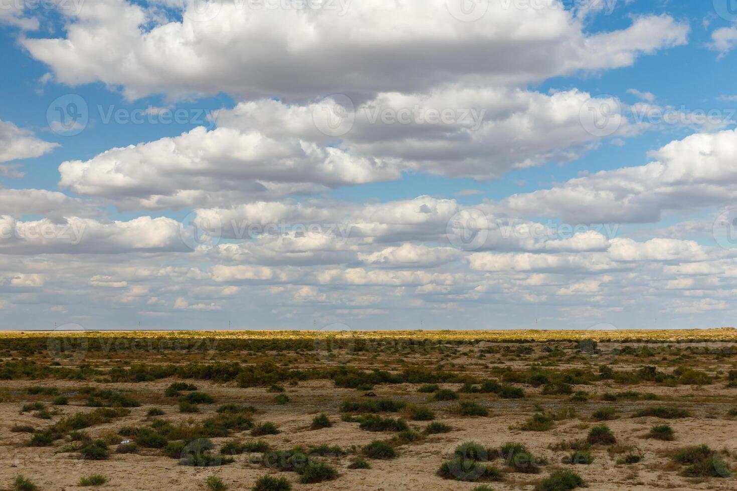 steppe in Kazakhstan, beautiful landscape, green grass and cloudy sky photo