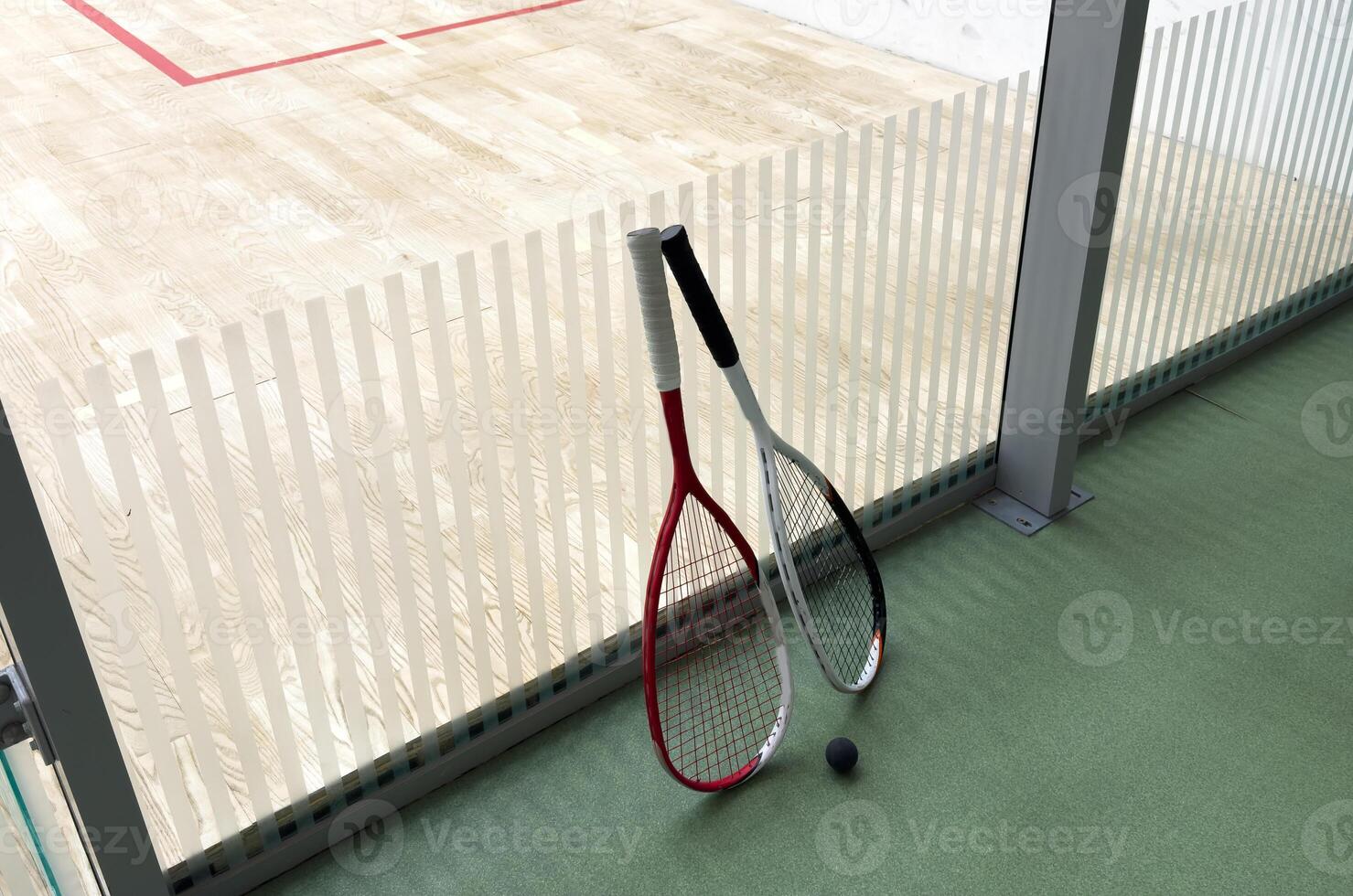Sports, above and racket on squash court for competition, challenge and training center. Exercise, interior and empty room with top view of wooden floor of gymnasium for games, fitness club and gear photo