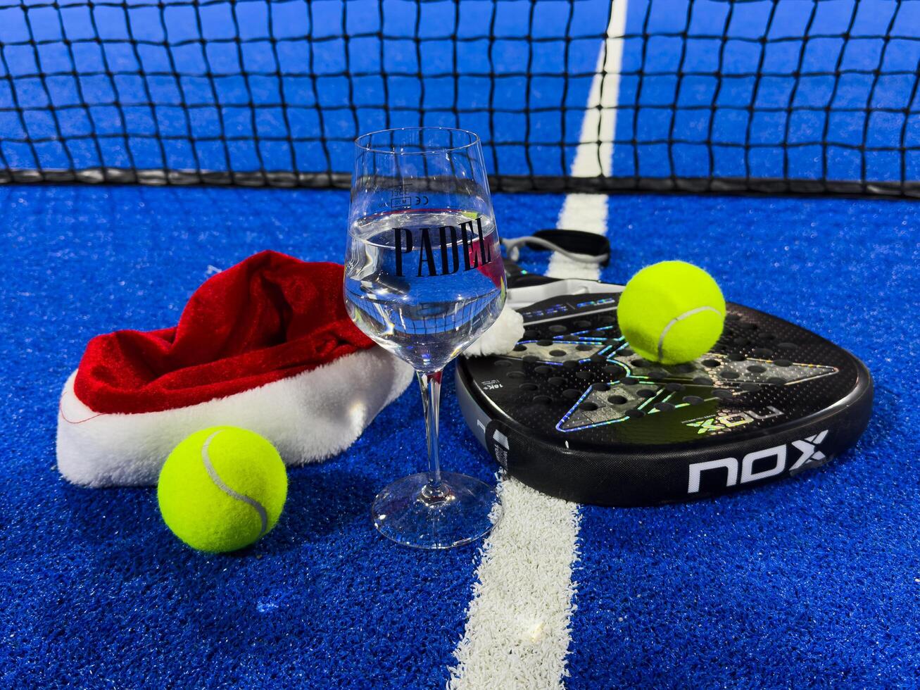 Ukraine Kyiv, December 23 2024. Christmas Open Padel Tournament. Poster for social networks for New Year's games. Padel tennis racket on tournament. paddle racket photo