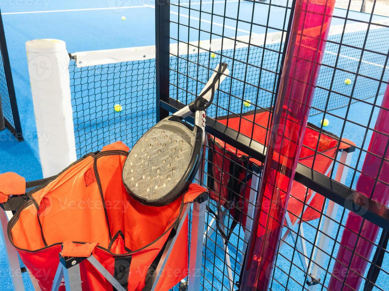 paddle sport on the paddle court, ball, rackets photo