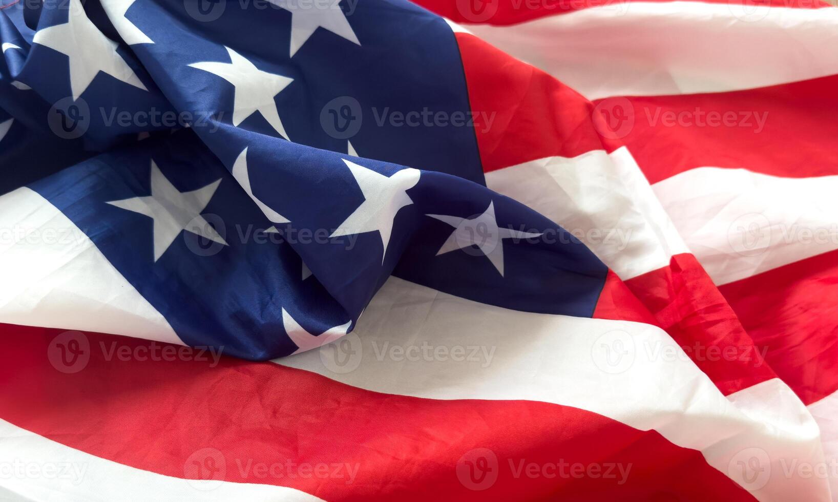 Natural fabric crumpled USA flag, rag American flag top view as texture or background, high resolution picture photo