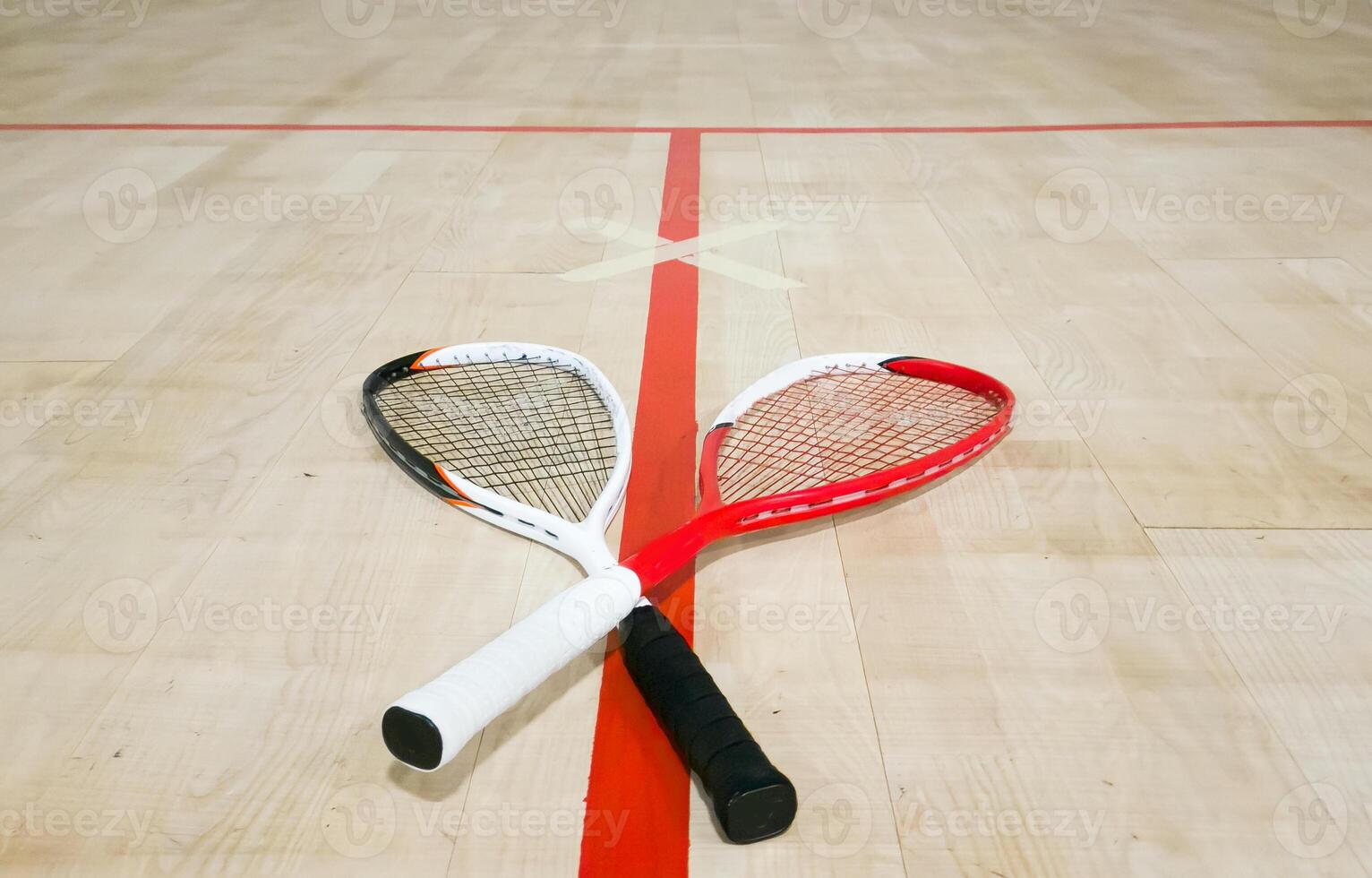 Sports, above and racket on squash court for competition, challenge and training center. Exercise, interior and empty room with top view of wooden floor of gymnasium for games, fitness club and gear photo