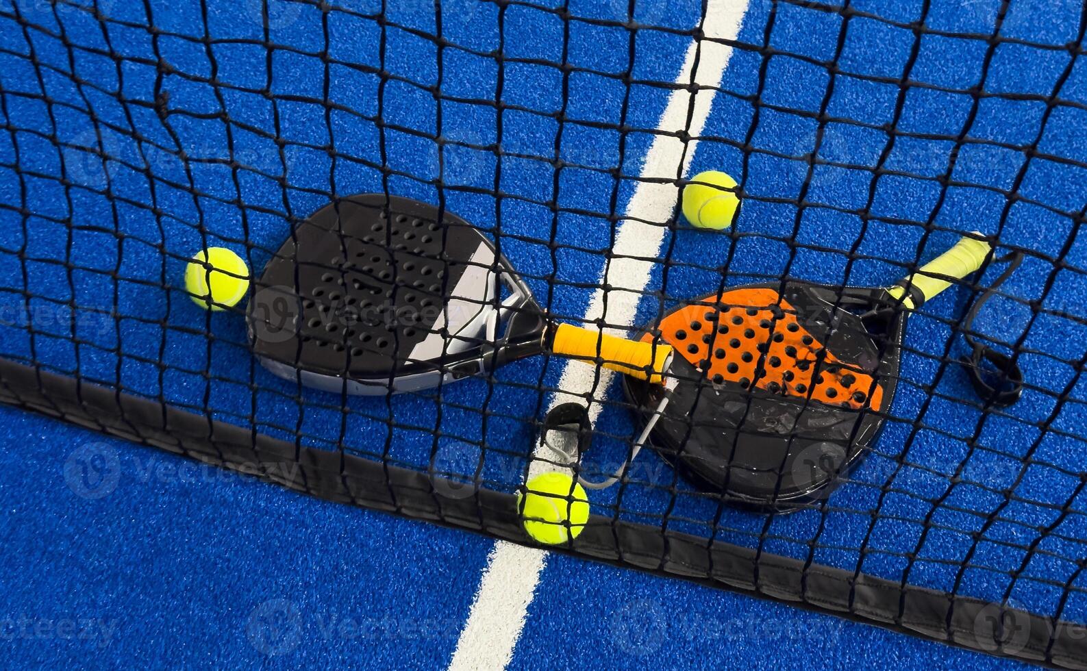 Padel tennis racket. Background with copy space. Sport court and balls. photo