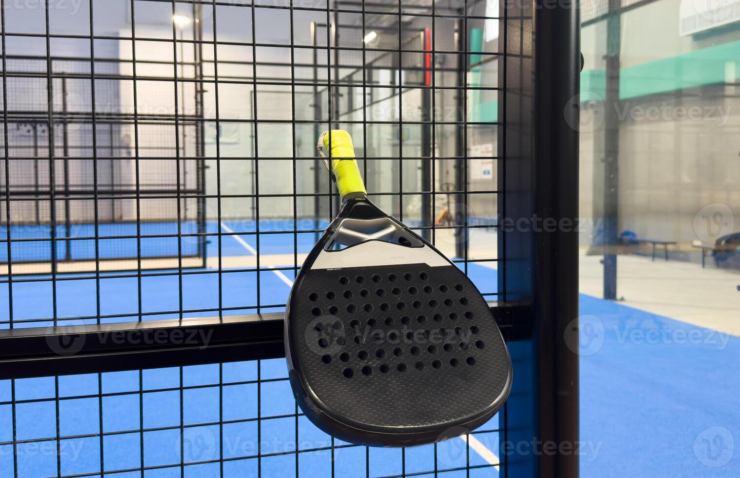 Padel tennis racket. Background with copy space. Sport court and balls. photo