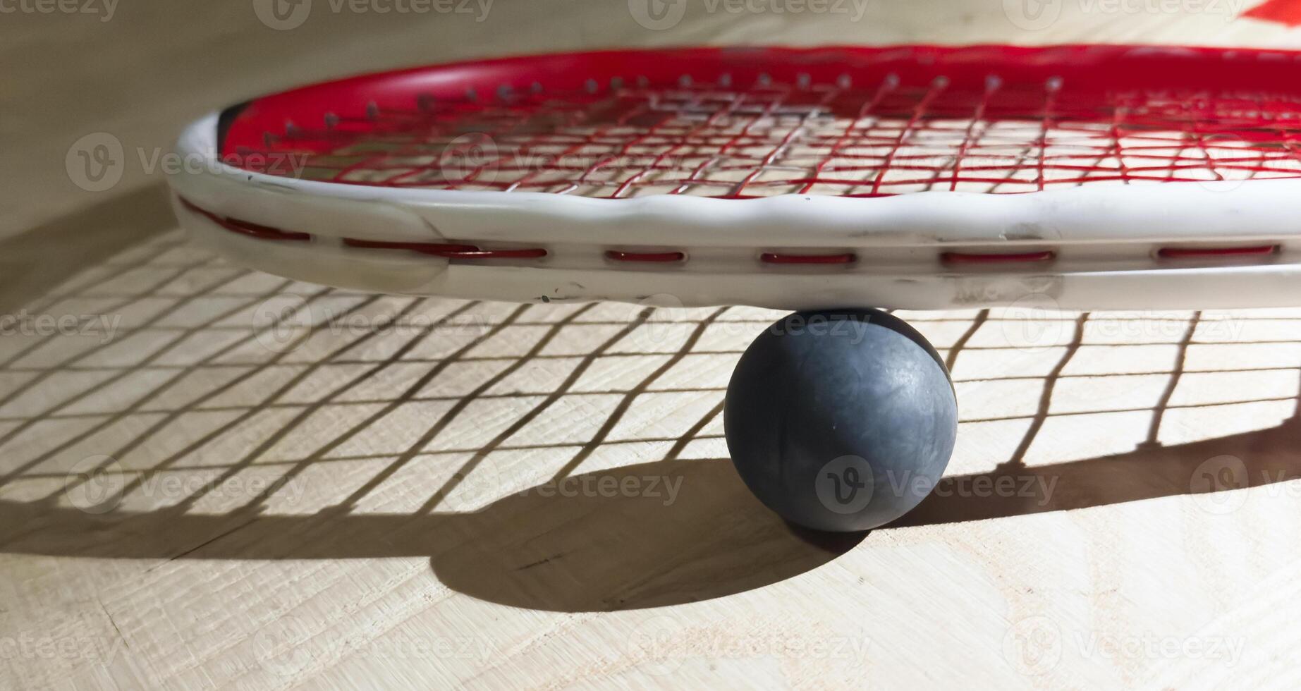 Sports, above and racket on squash court for competition, challenge and training center. Exercise, interior and empty room with top view of wooden floor of gymnasium for games, fitness club and gear photo