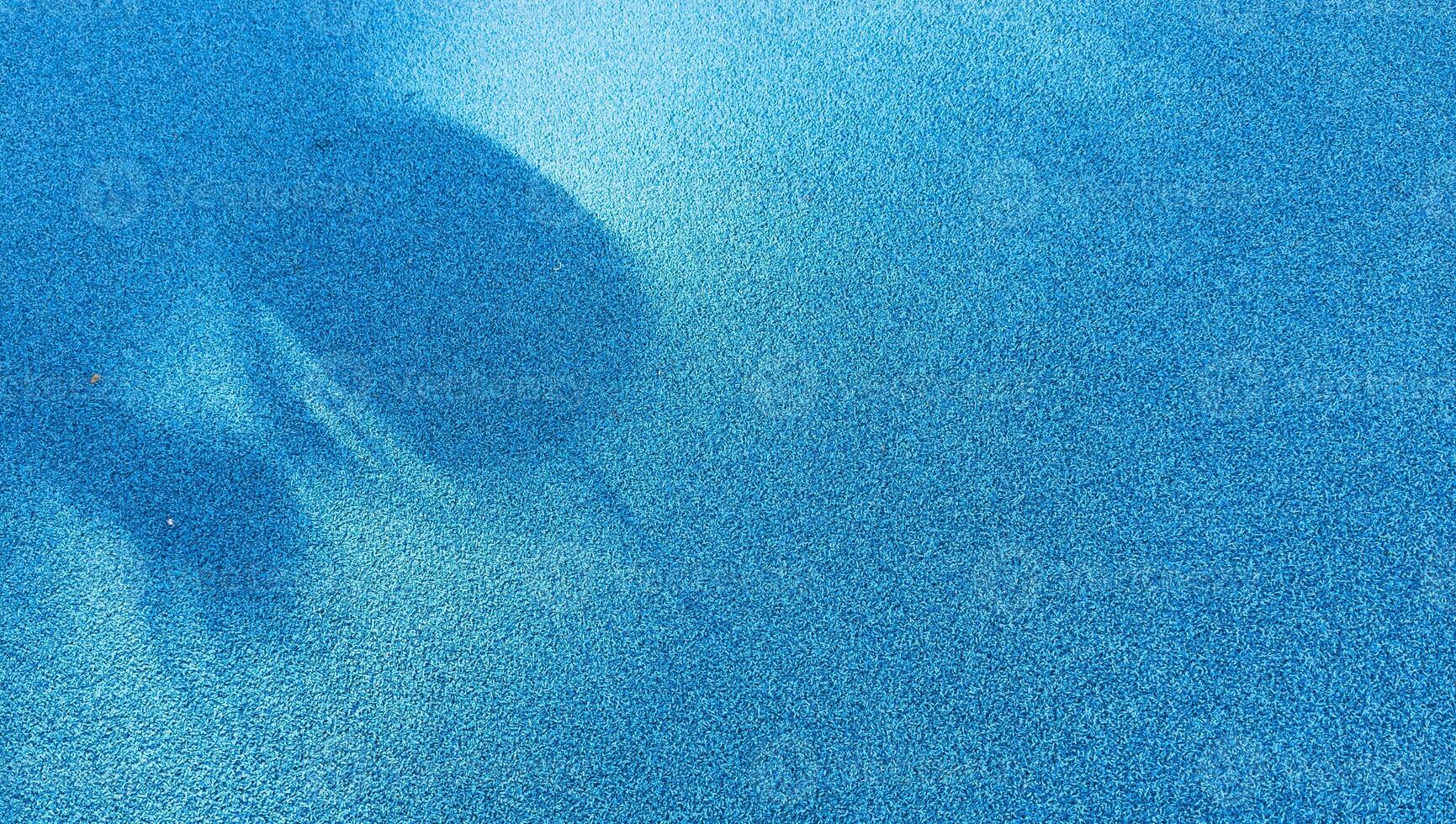 blue paddle tennis court, aerial shot photo