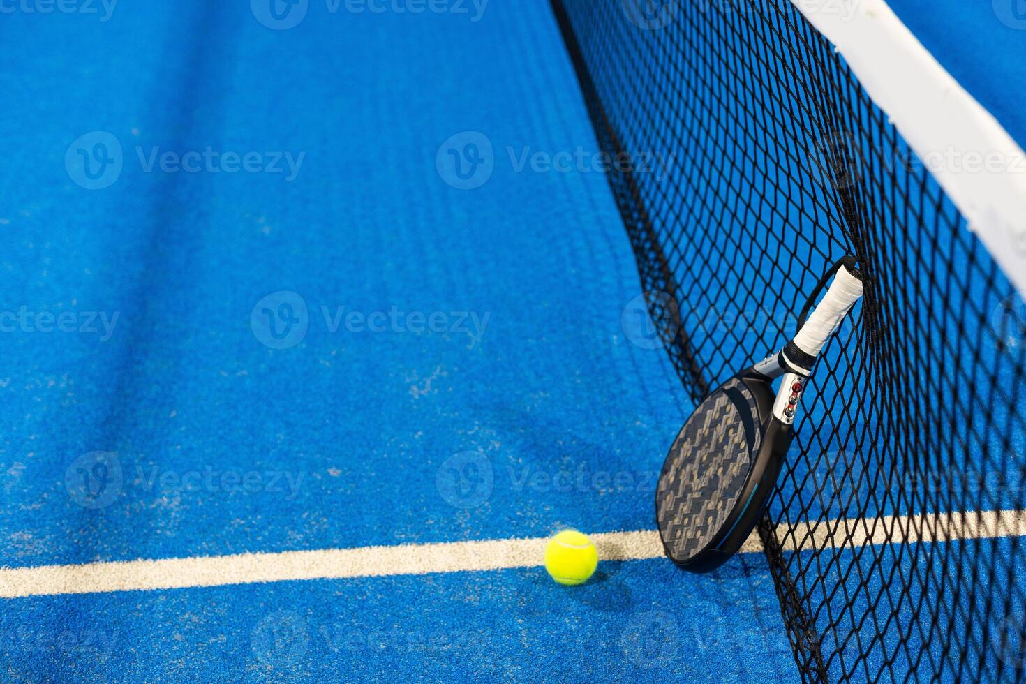 Paddle objects on blue turf photo
