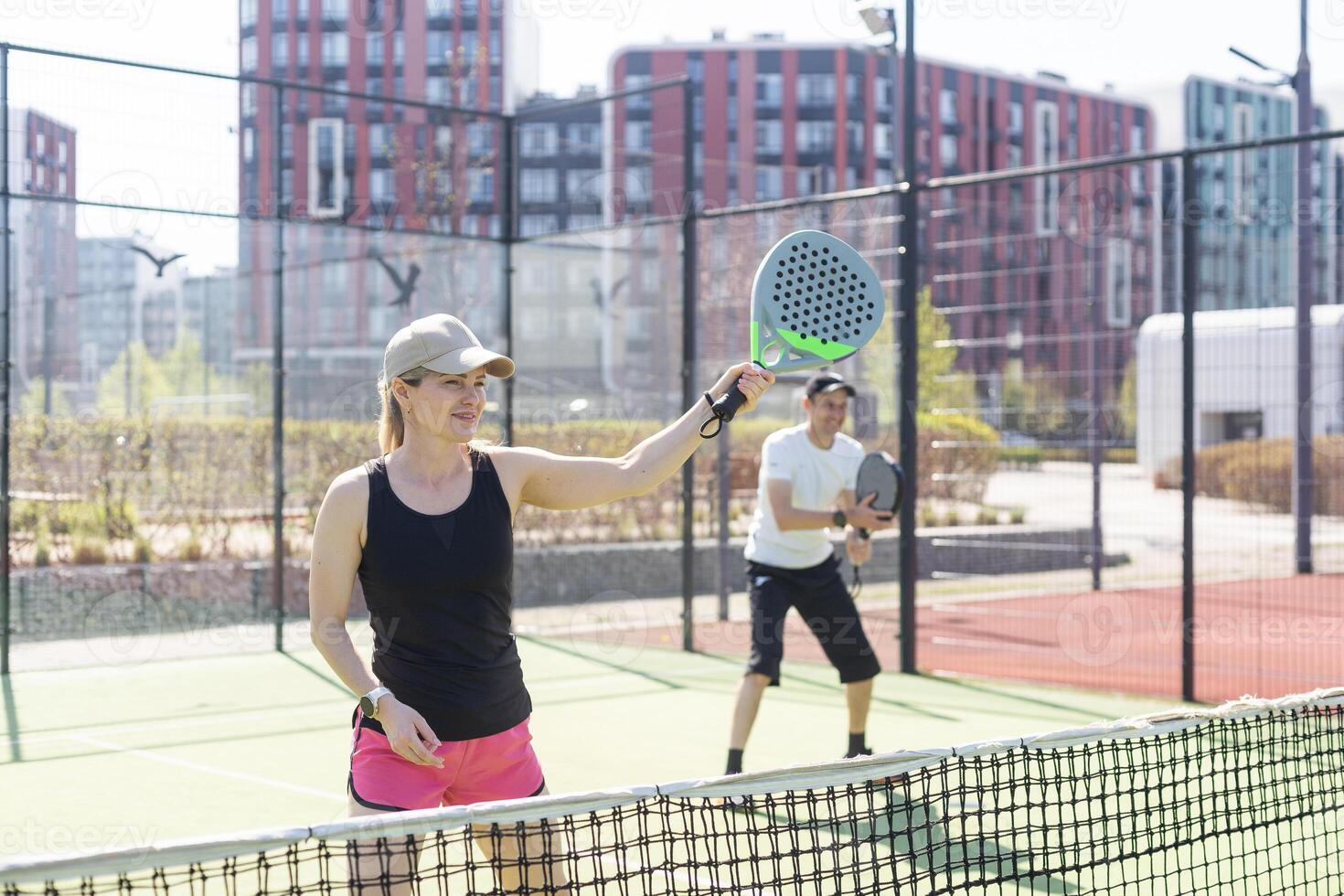 Padel lesson with a coach, personalized instruction in a supportive environment. photo
