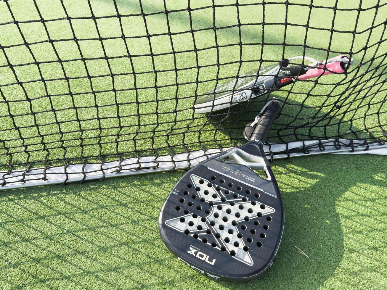 Kyiv, Ukraine, October 23, 2024. padel racket nox on a padel court with a ball photo