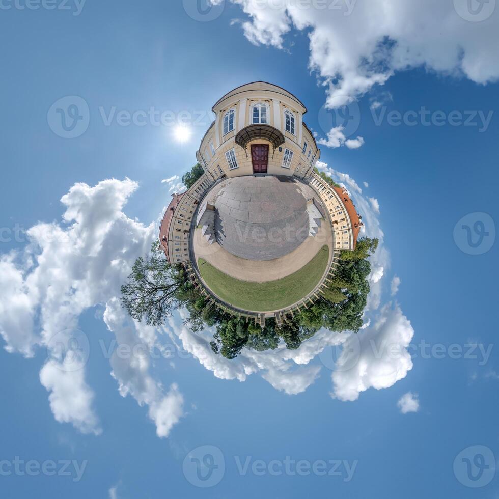 little planet and spherical aerial 360 panorama view on street ancient medieval castle with church and historic buildings with columns photo