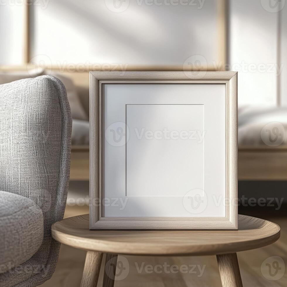 Wooden picture frame on a small round table photo