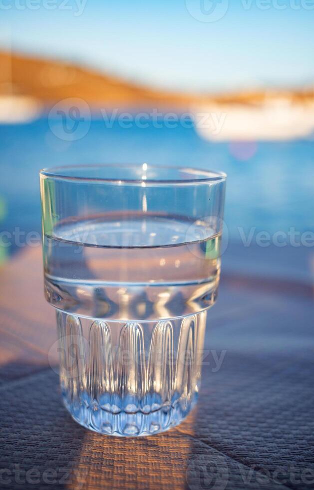 fresh clean glass of water on sunny day photo