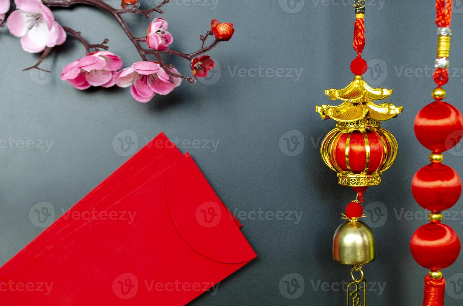 Chinese New Year decoration with red packets on black cover background with customizable space for text. Chinese New Year celebration. photo