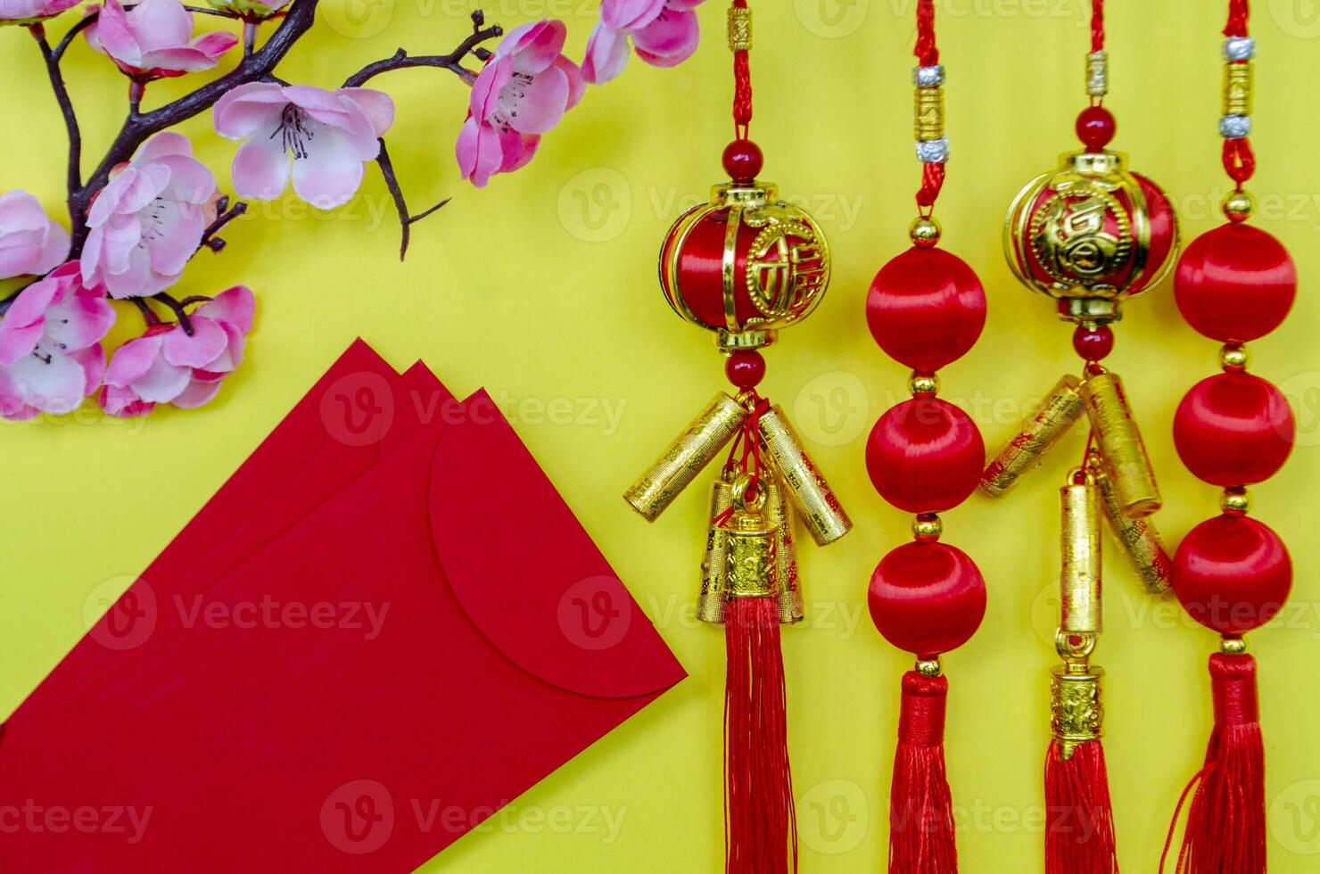 Chinese New Year decoration and red packets on yellow cover. Chinese New Year celebration concept photo