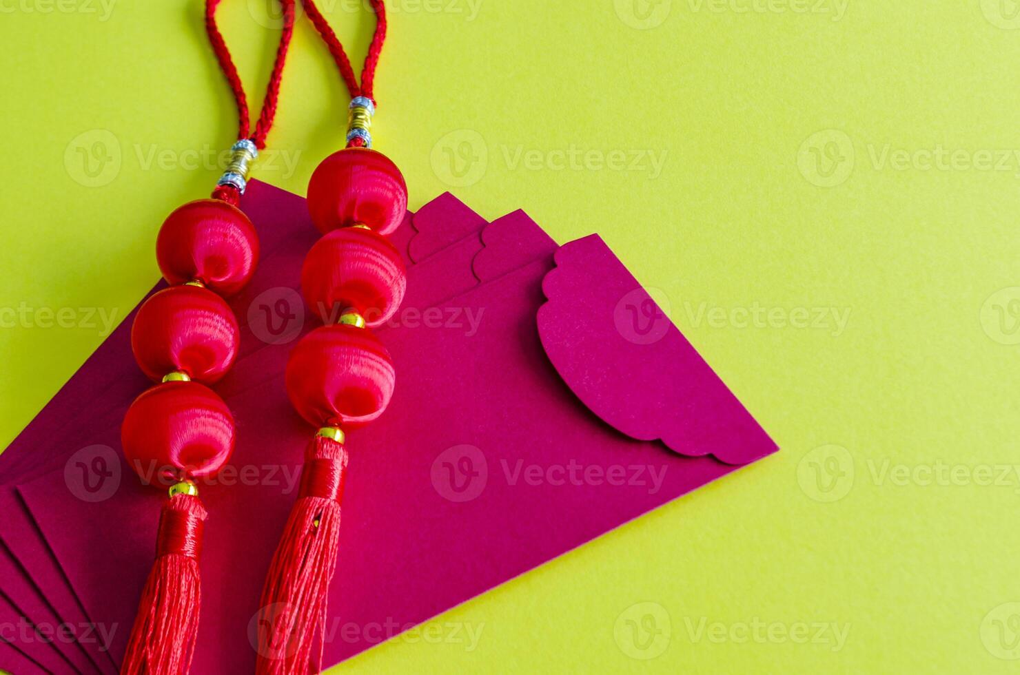 Chinese New Year lanterns on top of red packets on yellow cover background. Chinese New Year celebration photo