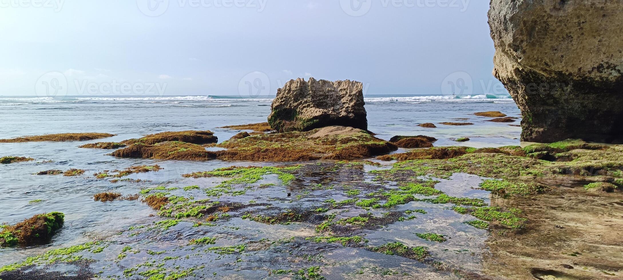 Beautiful view on suluban beach with big rocks in bali photo