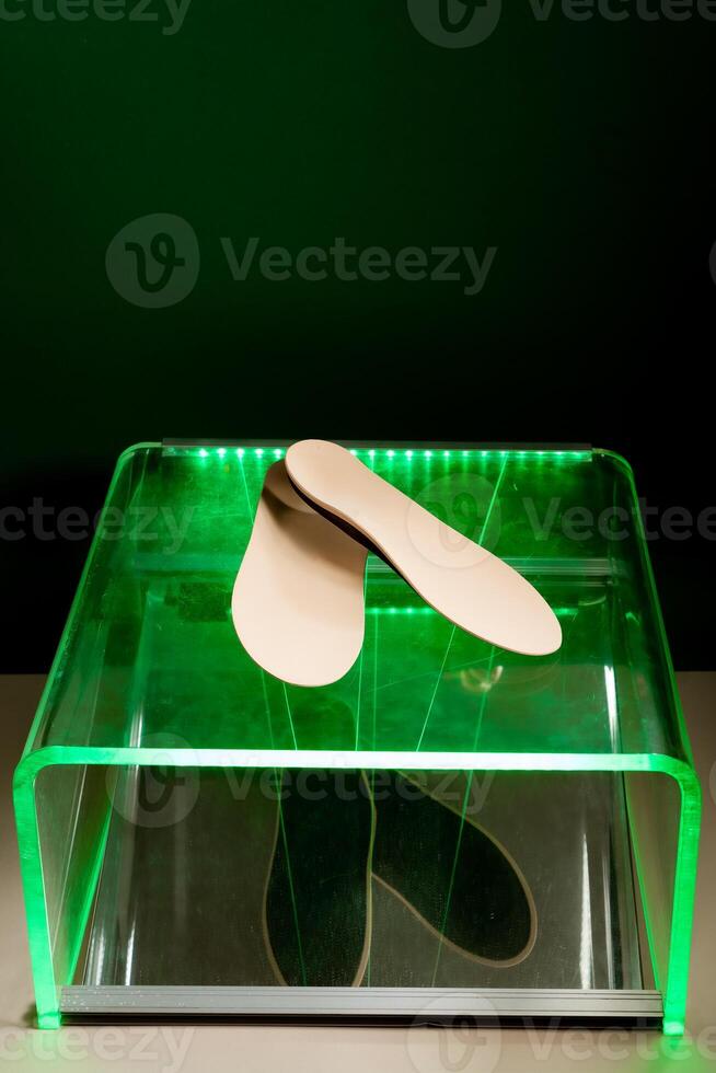 Orthopedic insoles for shoes on a colour background. Foot care photo