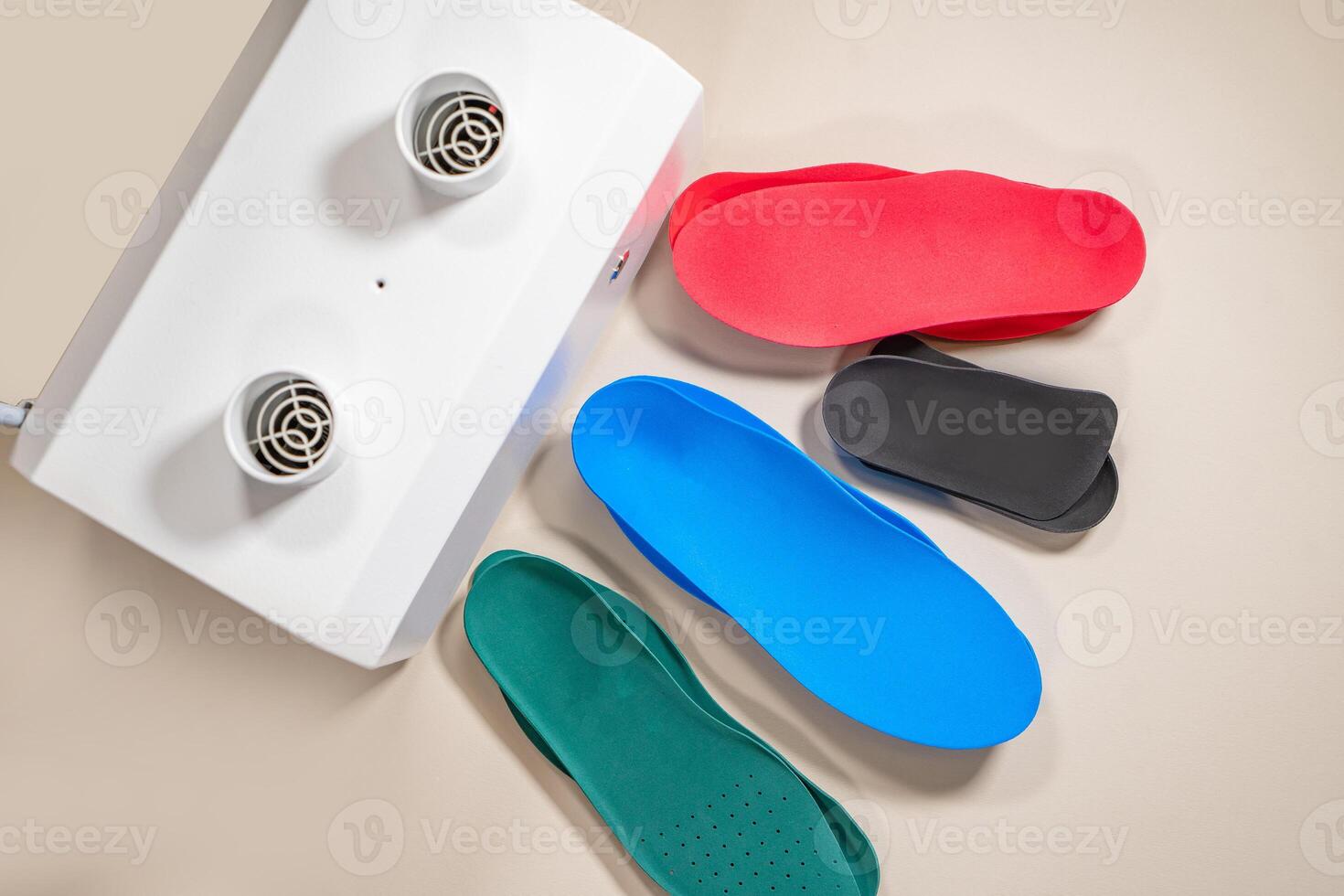 Orthopedic insoles for shoes on a colour background. Foot care photo