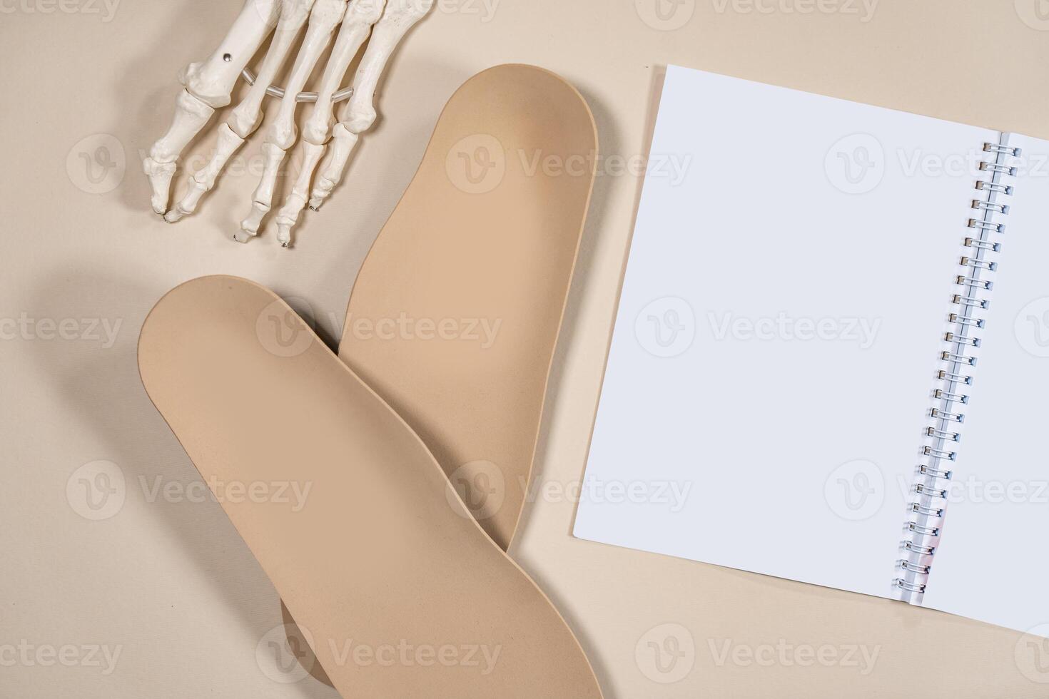 Orthopedic insoles for shoes on a colour background. Foot care photo