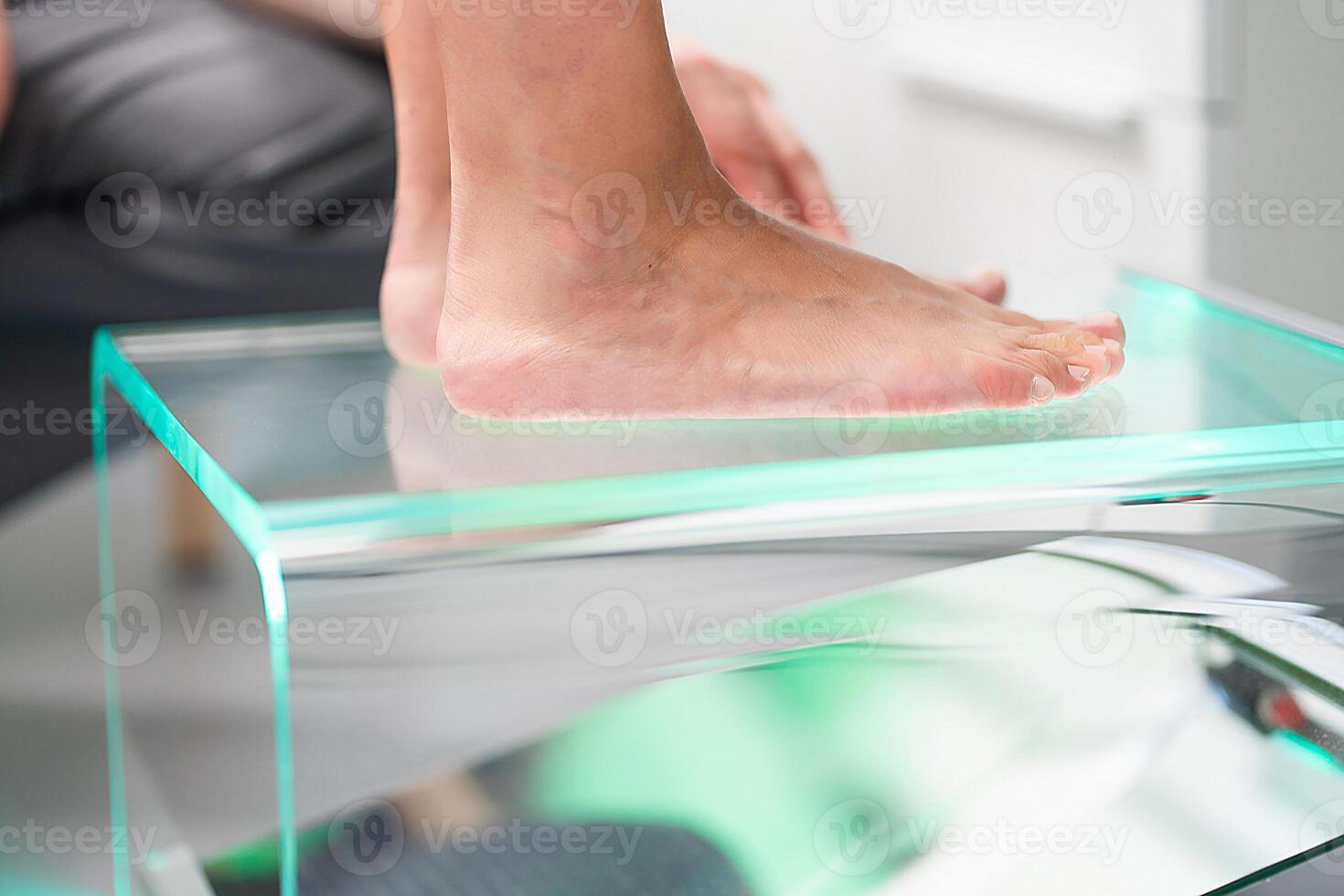 Orthopedic insole. The orthopedist works with the patient. Orthopedic clinic. Choice of insoles in an orthopedic clinic. The orthopedist offers the insole to the patient Foot care photo