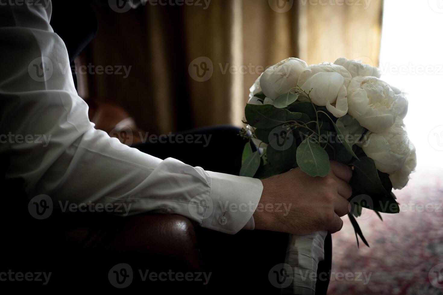 Accessories for men for wedding, groom in costume, belt, bow tie, wedding rings, bouquet and watches photo