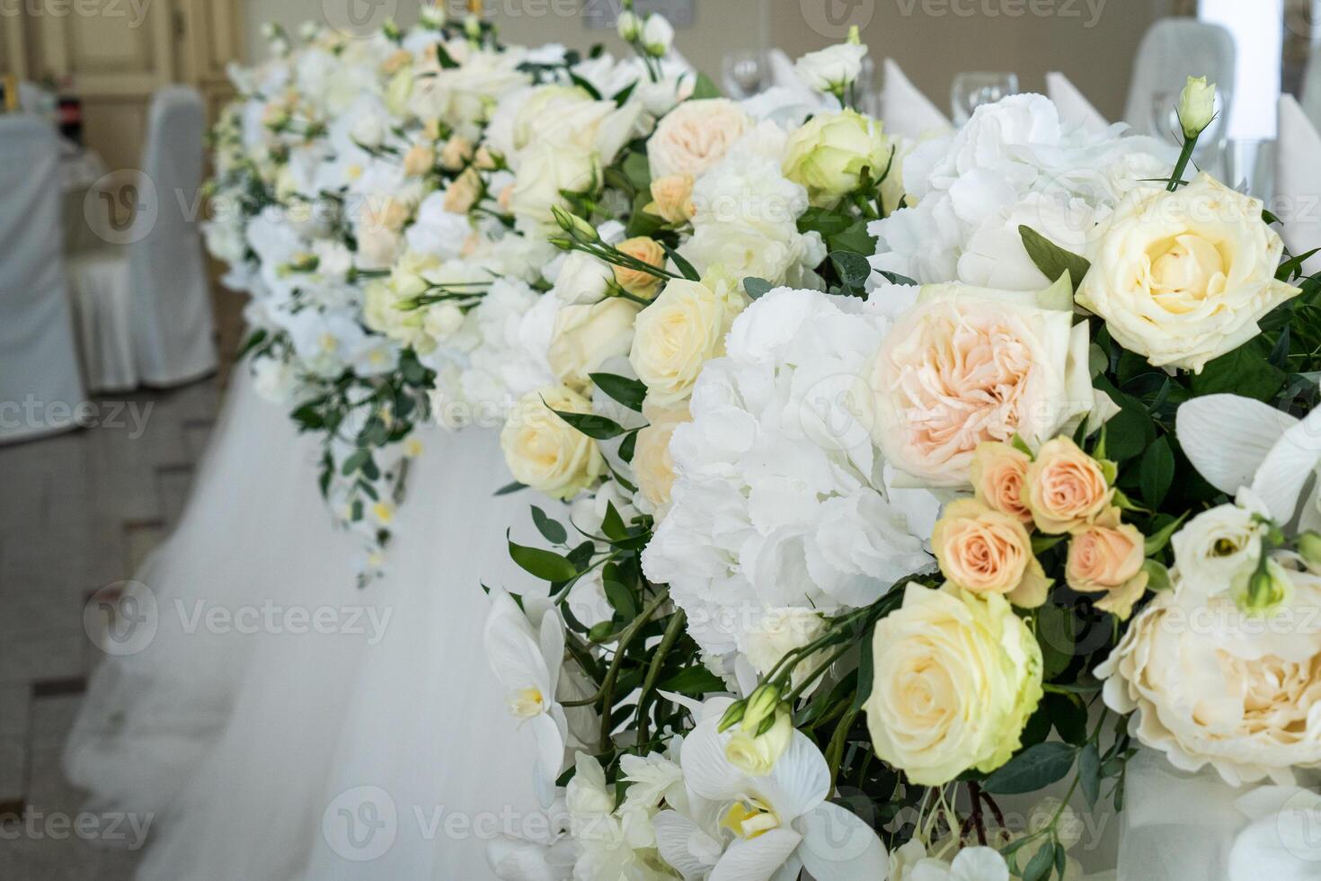 Wedding interior restaurant flowers, blossom floral decorations, white bloom for wedding ceremony photo