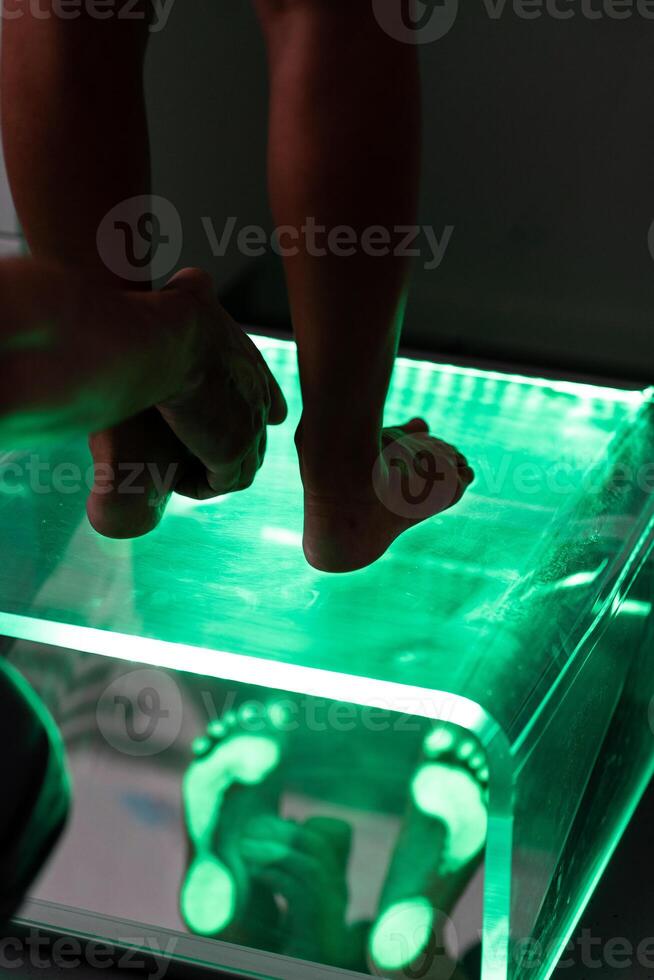 Orthopedic insole. The orthopedist works with the patient. Orthopedic clinic. Choice of insoles in an orthopedic clinic. The orthopedist offers the insole to the patient Foot care photo