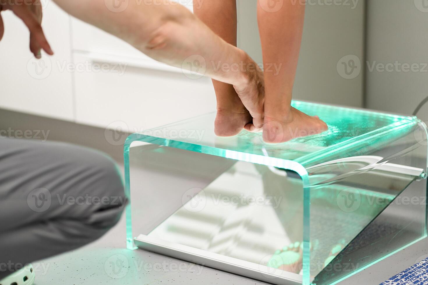 Orthopedic insole. The orthopedist works with the patient. Orthopedic clinic. Choice of insoles in an orthopedic clinic. The orthopedist offers the insole to the patient Foot care photo