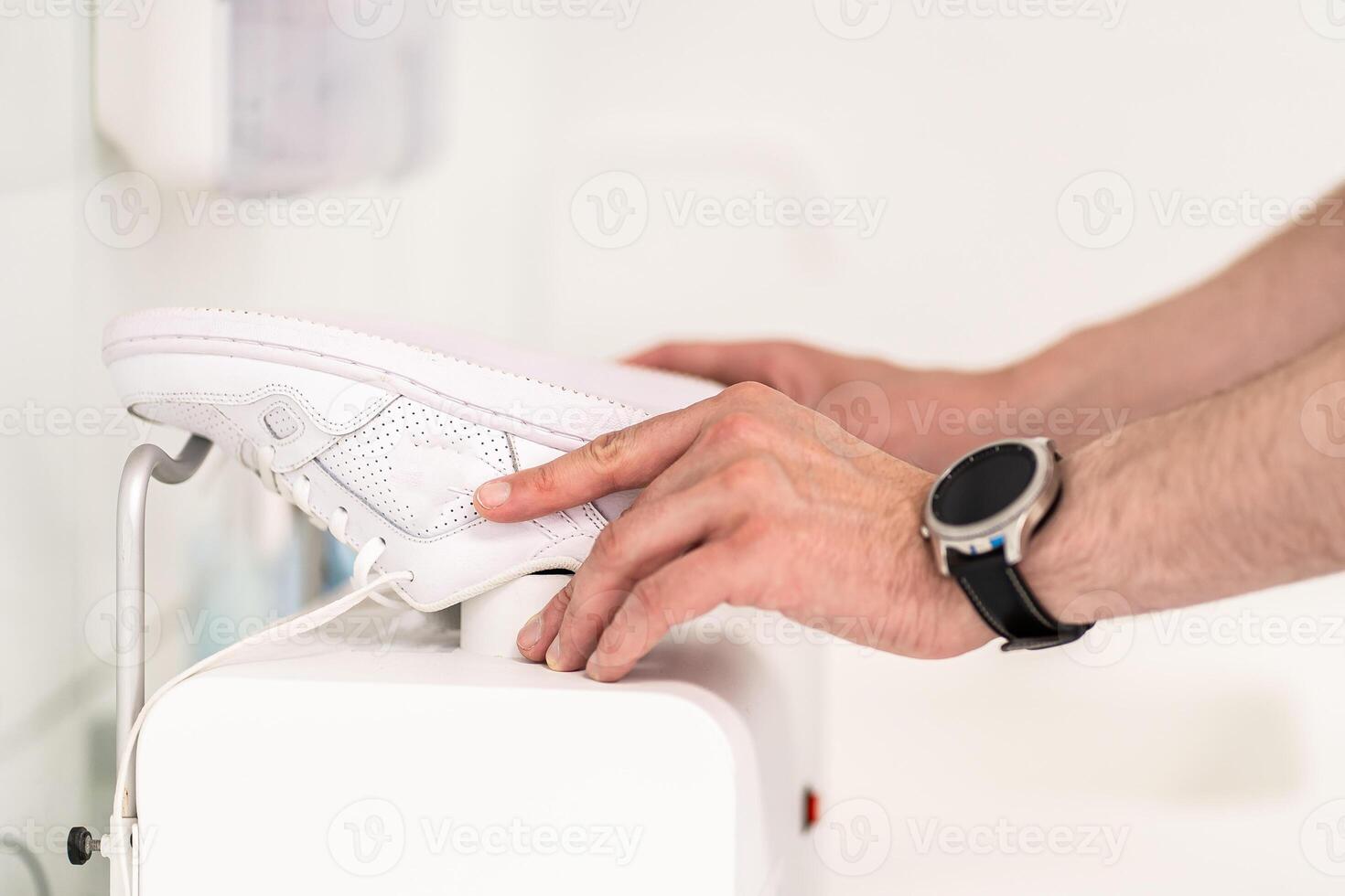 Orthopedic insole. The orthopedist works with the patient. Orthopedic clinic. Choice of insoles in an orthopedic clinic. The orthopedist offers the insole to the patient Foot care photo