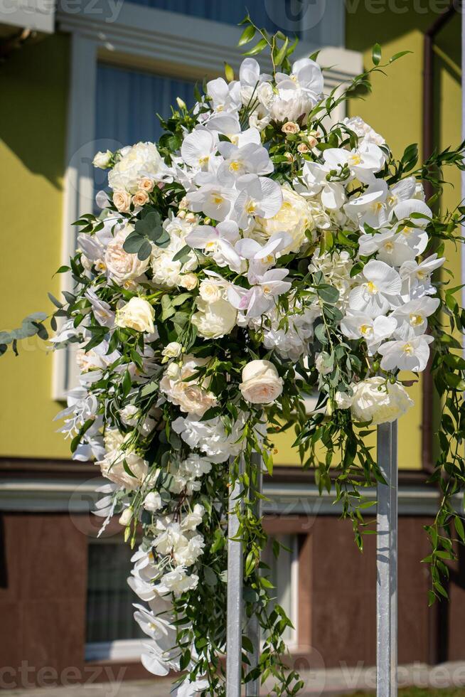 Wedding interior restaurant flowers, blossom floral decorations, white bloom for wedding ceremony photo