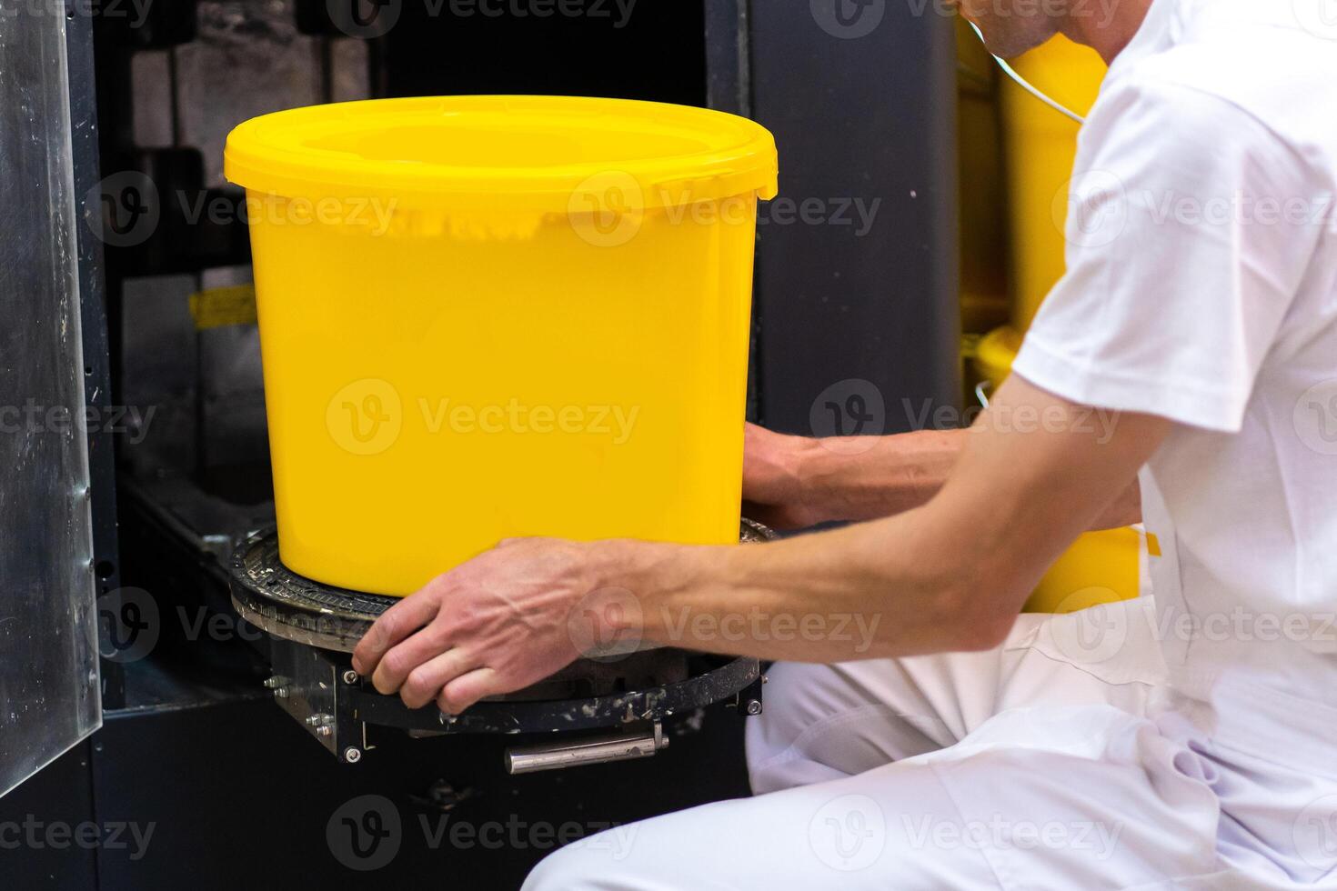 Worker and Paint dispenser. Mixer combined tinting machine. Ink mixing machine photo
